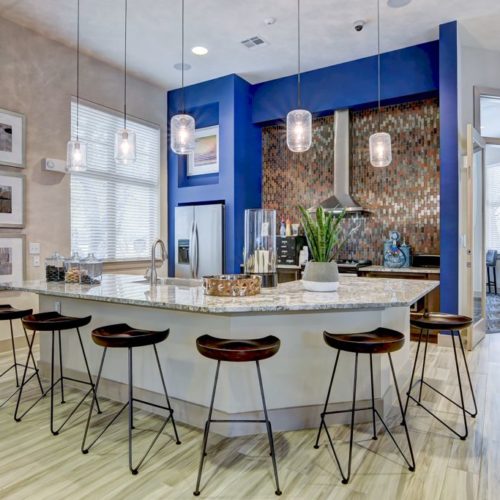Clubhouse demonstration kitchen with barstool seating