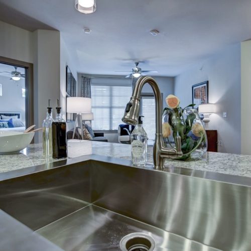 Model apartment kitchen with stainless steel sink