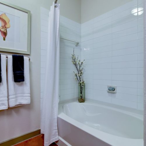 Model apartment bathtub with tile surrounds