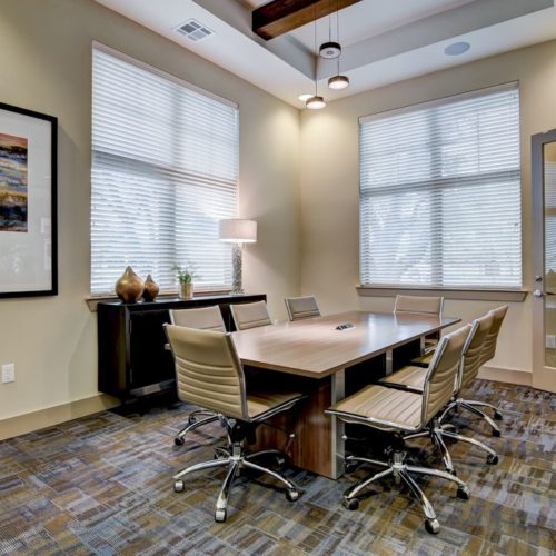 Interior of conference room with large table and seating