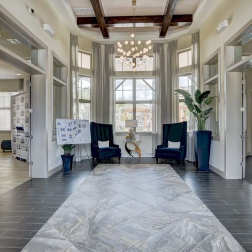 Interior of leasing center with seating and information displays
